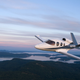 A photo of a Vision Jet flying in the air.